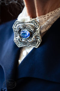 Grandmother's Detailed Silver Brooch with Blue Glass in the middle