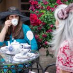 Friends having tea together in the garden.