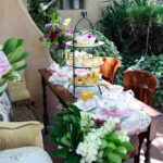 Teatime in the Garden with three-tiered tray and teapot.