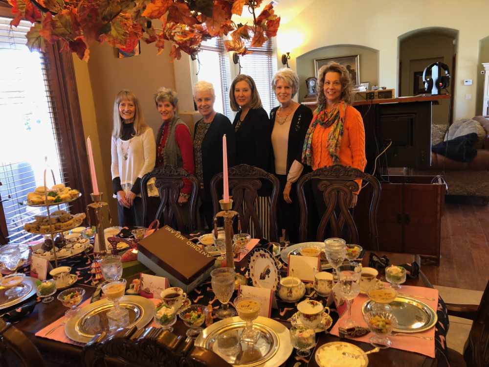 Ladies having tea with friends Group of ladies having tea at home together.
